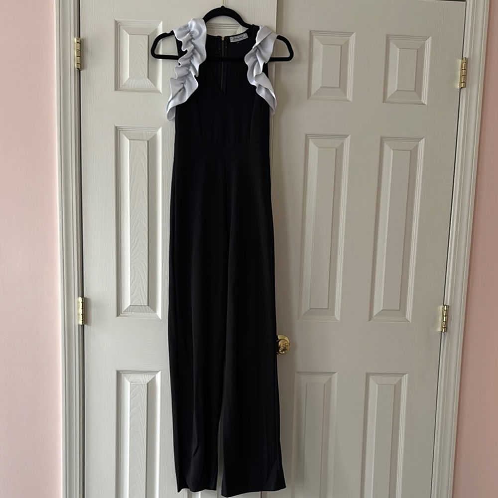 Black Jumpsuit with White Ruffle Sleeves